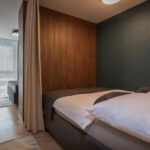 Spálňa s oddelenými posteľami v luxusnom apartmáne DaSus Luxury Tále.